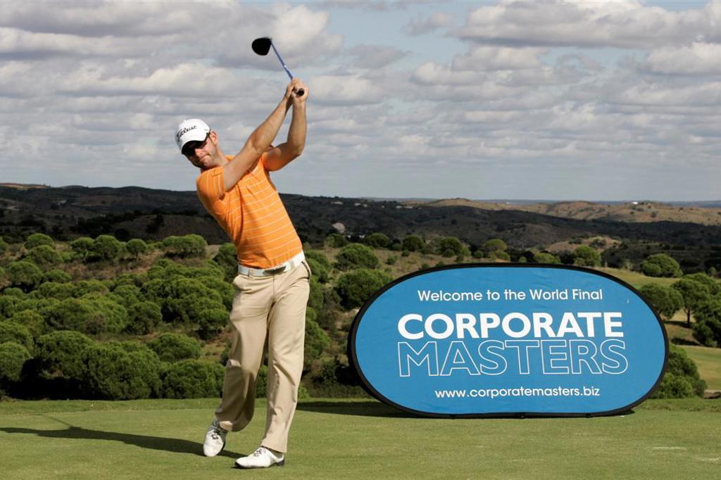 Printed banner beside a golf course