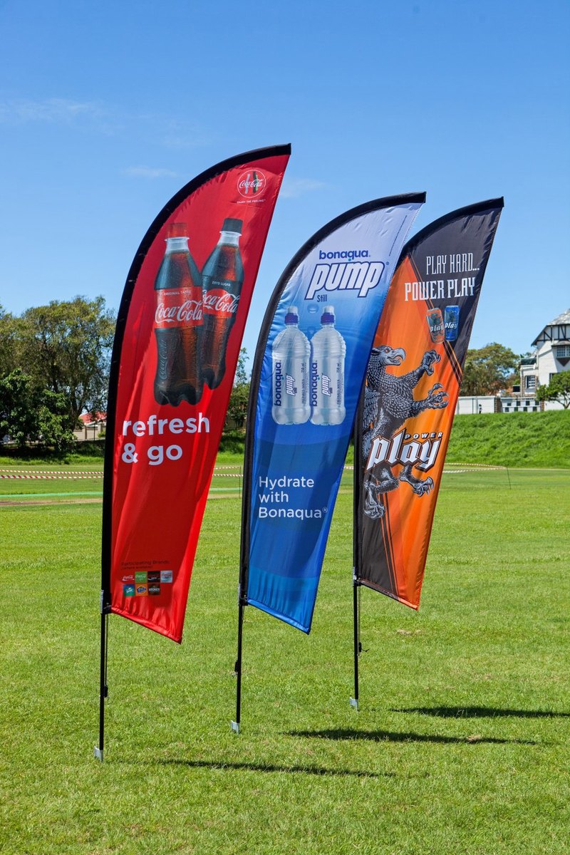 Branded feather flags on a pitch