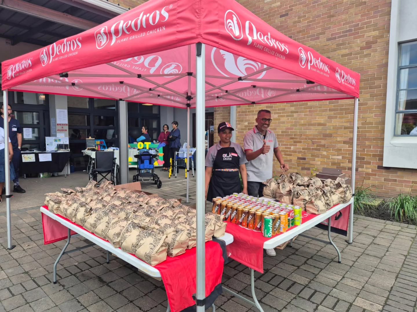 Branded gazebo and table on a market pitch