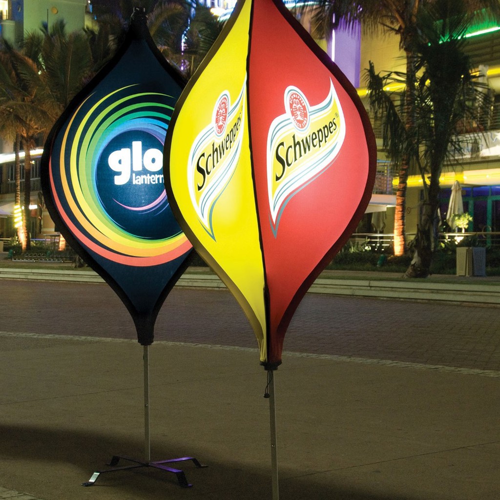 Illuminated lantern banners trading after dark