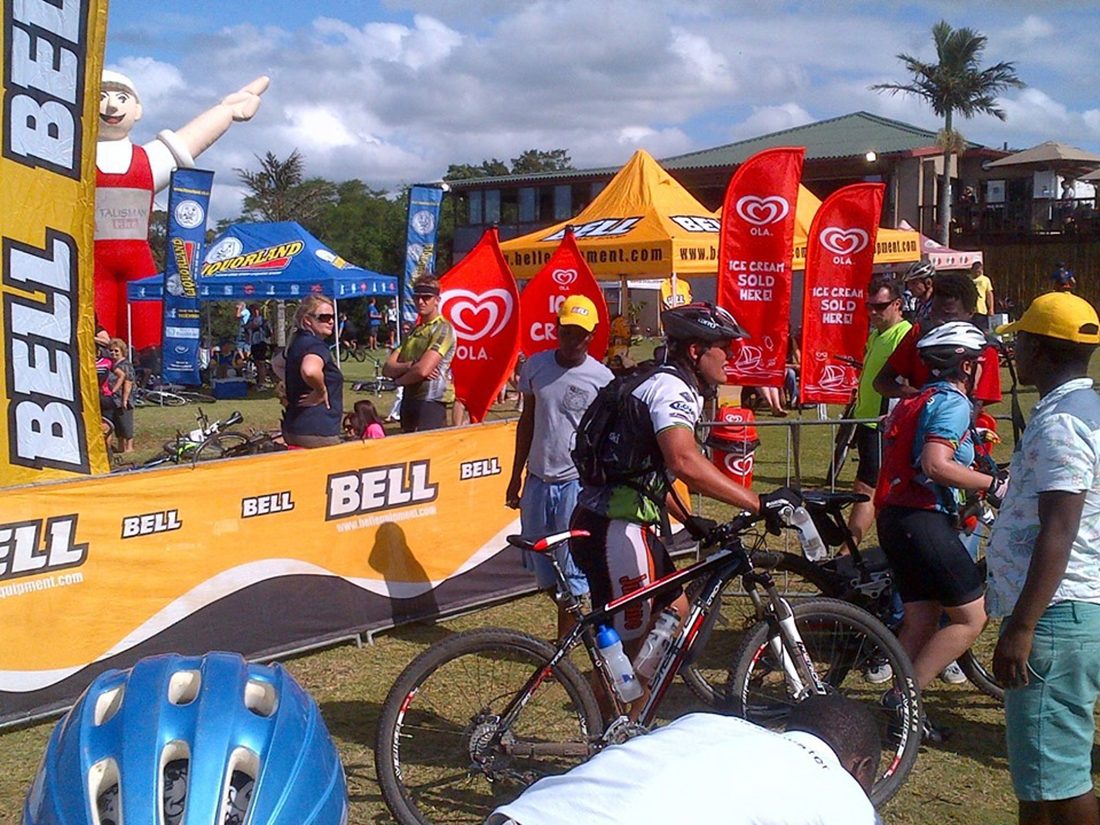 Branded barriers and flags at a cycling event