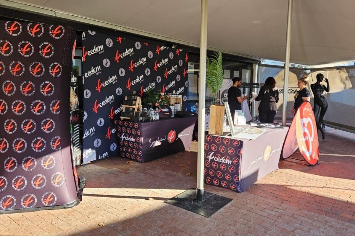 Indoor exhibition stand with a printed backdrop wall